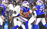 Jan 19, 2025; Orchard Park, New York, USA; Buffalo Bills running back Ray Davis (22) runs for a touchdown during the first quarter against the Baltimore Ravens in a 2025 AFC divisional round game at Highmark Stadium. Mandatory Credit: Mark Konezny-Imagn Images