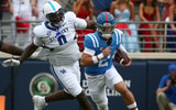Sep 28, 2024; Oxford, Mississippi, USA; Mississippi Rebels quarterback Jaxson Dart (2) runs the ball as Kentucky Wildcats defensive linemen Deone Walker (0) pursues during the first half at Vaught-Hemingway Stadium. Mandatory Credit: Petre Thomas-Imagn Images