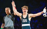 A bloodied Tyler Kasak of Penn State celebrates after defeating Iowa's Jacori Teemer 5-2 in the 157-pound bout on Friday, Jan. 31, 2025, in State College, Pa. The Nittany Lions won 30-8. (Dan Rainville / USA TODAY NETWORK via Imagn Images)