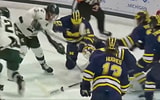 Michigan State's Tiernan Shoudy is turned away as he tries to jam the puck past Michigan goalie Cameron Korpi in the first period.