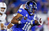 Oct 26, 2024; Lexington, Kentucky, USA; Kentucky Wildcats running back Jamarion Wilcox (10) carries the ball during the second quarter against the Auburn Tigers at Kroger Field. Mandatory Credit: Jordan Prather-Imagn Images
