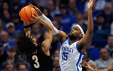 Kentucky Wildcats forward Ansley Almonor (15) blocks a shot by Vanderbilt Commodores guard Tyler Tanner (3) during the second half at Rupp Arena at Central Bank Center. Mandatory Credit: Jordan Prather-Imagn Images