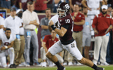 Oct 9, 2021; College Station, Texas, USA; Texas A&M Aggies quarterback Zach Calzada (10) rushes against the Alabama Crimson Tide in the fourth quarter at Kyle Field. Mandatory Credit: Thomas Shea-Imagn Images