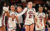 South Carolina Gamecocks forward Chloe Kitts (21) high fives a teammate after drawing a foul against the Vanderbilt Commodores during the second half at Bon Secours Wellness Arena. Mandatory Credit: Jim Dedmon-Imagn Images