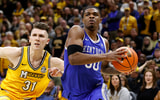 Mar 8, 2025; Columbia, Missouri, USA; Kentucky Wildcats guard Otega Oweh (00) drives past Missouri Tigers guard Caleb Grill (31) in the second half at Mizzou Arena. Mandatory Credit: Gary Rohman-Imagn Images