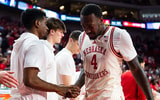 Nebraska Juwan Gary hugs Iowa players