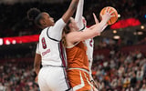 exas Longhorns forward Taylor Jones (44) goes up for a shot surrounded by South Carolina Gamecocks forward Joyce Edwards (8) and forward Chloe Kitts (21) during the first half at Bon Secours Wellness Arena. Mandatory Credit: Jim Dedmon-Imagn Images