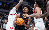 USC Trojans forward Saint Thomas (0) shoots the ball while Rutgers Scarlet Knights guard Dylan Harper (2) defends in the first half at Gainbridge Fieldhouse