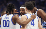 Kentucky forward Ansley Almonor talks to his teammates in a huddle - Dr. Michael Huang, Kentucky Sports Radio