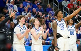 Trent Noah celebrates on the bench with Travis Perry, Amari Williams and Otega Oweh in Kentucky's win over Troy -- Mont Dawson, Kentucky Sports Radio