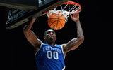 Mar 28, 2025; Indianapolis, IN, USA; Kentucky Wildcats guard Otega Oweh (00) dunks the ball against the Tennessee Volunteers in the second half during a Midwest Regional semifinal of the 2025 NCAA tournament at Lucas Oil Stadium. Mandatory Credit: Robert Goddin-Imagn Images