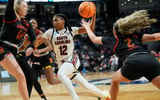 Mar 28, 2025; Birmingham, AL, USA; Maryland Terrapins forward Allie Kubek (14) and Maryland Terrapins guard Kaylene Smikle (2) defend South Carolina Gamecocks guard MiLaysia Fulwiley (12) at Legacy Arena in the Sweet 16. South Carolina advanced to the Elite 8 wtih a 71-67 victory. Mandatory Credit: Gary Cosby Jr.-Tuscaloosa News