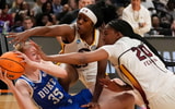 Duke Blue Devils forward Toby Fournier (35) battles South Carolina Gamecocks forward Sania Feagin (20) and South Carolina Gamecocks guard Raven Johnson (25) for control of a ball on the floor at Legacy Arena. Mandatory Credit: Gary Cosby Jr.-Tuscaloosa News