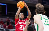 Mar 13, 2025; Indianapolis, IN, USA; Indiana Hoosiers forward Mackenzie Mgbako (21) shoots the ball while Oregon Ducks guard TJ Bamba (5) defends in the first half at Gainbridge Fieldhouse. Mandatory Credit: Trevor Ruszkowski-Imagn Images