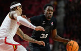 Michigan State Spartans forward Xavier Booker (34) handles the ball against Maryland Terrapins guard DeShawn Harris-Smith (5) during the first half at Xfinity Center. - Reggie Hildred, USA TODAY Sports