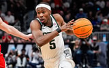 Michigan State guard Tre Holloman (5) dribbles against Ole Miss guard Sean Pedulla (3) during the second half of the Sweet 16 round of NCAA tournament at State Farm Arena in Atlanta, Ga. - Junfu Han, USA TODAY Sports