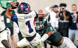 Michigan State's Anthony Jones, right, tackles Florida Atlantic's Cam Fancher during the fourth quarter on Friday, Aug. 30, 2024, at Spartan Stadium in East Lansing. - Nick King, USA TODAY Sports