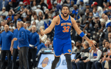 Apr 27, 2025; Detroit, Michigan, USA; New York Knicks center Karl-Anthony Towns (32) hits a three point basket late in the fourth quarter of game four of first round for the 2025 NBA Playoffs against the Detroit Pistons at Little Caesars Arena. Mandatory Credit: David Reginek-Imagn Images