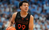 Mar 1, 2025; Chapel Hill, North Carolina, USA;  Miami (Fl) Hurricanes guard Divine Ugochukwu (99) with the ball in the first half at Dean E. Smith Center. Mandatory Credit: Bob Donnan-Imagn Images