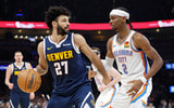 Mar 10, 2025; Oklahoma City, Oklahoma, USA;Denver Nuggets guard Jamal Murray (27) drives against Oklahoma City Thunder guard Shai Gilgeous-Alexander (2) during the second quarter at Paycom Center. Mandatory Credit: Alonzo Adams-Imagn Images