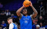Mar 20, 2025; Milwaukee, WI, USA; Kentucky Wildcats guard Otega Oweh (0) shoots during NCAA Tournament First Round Practice at Fiserv Forum. Mandatory Credit: Jeff Hanisch-Imagn Images