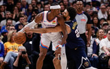 May 11, 2025; Denver, Colorado, USA; Oklahoma City Thunder guard Shai Gilgeous-Alexander (2) controls the ball under pressure from Denver Nuggets guard Jamal Murray (27) in the fourth quarter during game four of the second round of the 2025 NBA Playoffs at Ball Arena. Mandatory Credit: Isaiah J. Downing-Imagn Images