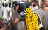 Jaime Torres celebrates a Preakness Stakes win with Seize the Grey, via Mitch Stringer-Imagn Images