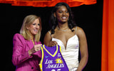 Sania Feagin poses with WNBA commissioner Cathy Engelbert after being selected with the number twenty one overall pick to the Los Angeles Sparks in the 2025 WNBA Draft at The Shed at Hudson Yards. Mandatory Credit: Vincent Carchietta-Imagn Images