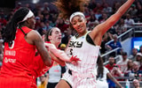 Chicago Sky forward Angel Reese fouled by Caitlin Clark