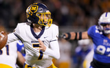 Moeller Crusaders Matt Ponatoski (7) looks to throw in the first half of a second-round Division I OHSAA high school football game against the St. Xavier Bombers, Friday, Nov. 3, 2023, at St. Xavier High School s RDI Field in Cincinnati. | © Kareem Elgazzar/The Enquirer / USA TODAY NETWORK