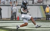 Nov 2, 2024; Orlando, Florida, USA; UCF Knights running back RJ Harvey (7) scores a touchdown against the Arizona Wildcats during the first quarter at FBC Mortgage Stadium. Mandatory Credit: Mike Watters-Imagn Images