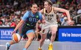 Atlanta Dream guard Te-Hina Paopao (2) drives on Indiana Fever guard Caitlin Clark (22) in the first half at State Farm Arena. Mandatory Credit: Brett Davis-Imagn Images