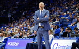 Feb 8, 2025; Lexington, Kentucky, USA; Kentucky Wildcats head coach Mark Pope smiles as he watches the action during the second half against the South Carolina Gamecocks at Rupp Arena at Central Bank Center. Mandatory Credit: Jordan Prather-Imagn Images