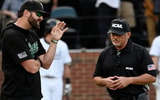 Wright State baseball coach Alex Sogard talks to an umpire vs. Vanderbilt