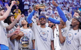 May 28, 2025; Oklahoma City, Oklahoma, USA; Oklahoma City Thunder guard Shai Gilgeous-Alexander holds up the MVP trophy for the western conference finals for the 2025 NBA Playoffs at Paycom Center. Mandatory Credit: Alonzo Adams-Imagn Images
