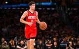 Apr 11, 2025; Los Angeles, California, USA; Houston Rockets guard Reed Sheppard (15) moves the ball against the Los Angeles Lakers during the second half at Crypto.com Arena. Mandatory Credit: Jonathan Hui-Imagn Images