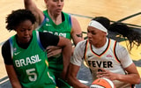 Indiana Fever forward-center Makayla Timpson (21) tries to gather the ball as Brazil's Ayla McDowell (5) defends during an WNBA game May 4, 2025 at Carver-Hawkeye Arena in Iowa City, Iowa.