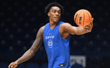 Mar 27, 2025; Indianapolis, IN, USA; Kentucky Wildcats center Amari Williams (22) stretches during the NCAA tournament midwest regional practice day at Lucas Oil Stadium. Mandatory Credit: Robert Goddin-Imagn Images