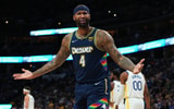 Apr 24, 2022; Denver, Colorado, USA; Denver Nuggets center DeMarcus Cousins (4) reacts to a foul in the second quarter against the Golden State Warriors of the first round for the 2022 NBA playoffs at Ball Arena. Mandatory Credit: Ron Chenoy-Imagn Images