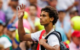 Aug 29, 2024; Flushing, NY, USA; Gabriel Diallo of Canada in action against Tommy Paul of the United States on day six of the 2024 U.S. Open tennis tournament at the USTA Billie Jean King National Tennis Center. Mandatory Credit: Mike Frey-Imagn Images