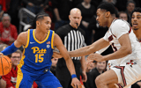 Mar 1, 2025; Louisville, Kentucky, USA; Pittsburgh Panthers guard Jaland Lowe (15) dribbles against Louisville Cardinals center Frank Anselem-Ibe (13) during the second half at KFC Yum! Center. Louisville defeated Pittsburgh 79-68. Mandatory Credit: Jamie Rhodes-Imagn Images