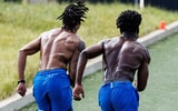 The Kentucky football team sprints hills during summer conditioning, via UK Athletics