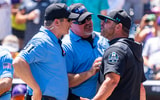 College World Series Coastal Carolina Kevin Schnall LSU ejection umpire