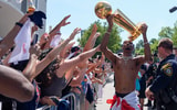 Oklahoma City Thunder guard Shai Gilgeous-Alexander carries the Larry O'Brien trophy as he celebrates with fans as the Oklahoma City Thunder celebrate their first NBA Finals title win with a champions parade throughout downtown Oklahoma City on Tuesday, June 24, 2025. Mandatory Credit: Bryan Terry/USA TODAY NETWORK via Imagn Images