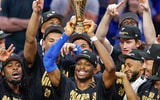 Jun 22, 2025; Oklahoma City, Oklahoma, USA; Oklahoma City Thunder guard Shai Gilgeous-Alexander (2) holds up his NBA Finals Bill Russell MVP trophy at the end of game seven of the 2025 NBA Finals after defeating the Indiana Pacers at Paycom Center. Mandatory Credit: Alonzo Adams-Imagn Images