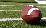 Closeup of American Football on Field