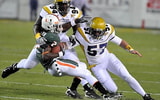 Shane Bowen (57) making a tackle during his career at Georgia Tech