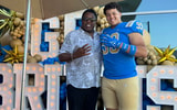 Recruit Marcus Almada and UCLA DL coach Jethro Franklin