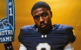 Brayden Robinson poses with a foam finger during a photoshoot on his Notre Dame official visit