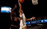 Cincinnati Bearcats guard Dan Skillings Jr. (0) dunks as Arizona State Sun Devils forward Jayden Quaintance (21) defends in the second half of the NCAA basketball game at Fifth Third Arena in Cincinnati on Saturday, January 18, 2025. © Albert Cesare/The Enquirer / USA TODAY NETWORK via Imagn Images